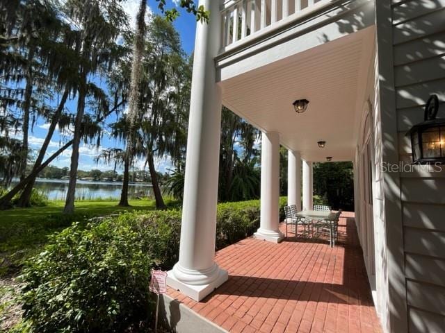 15612 Howell Park Ln, Tampa, FL 33625 - porch featuring a water view