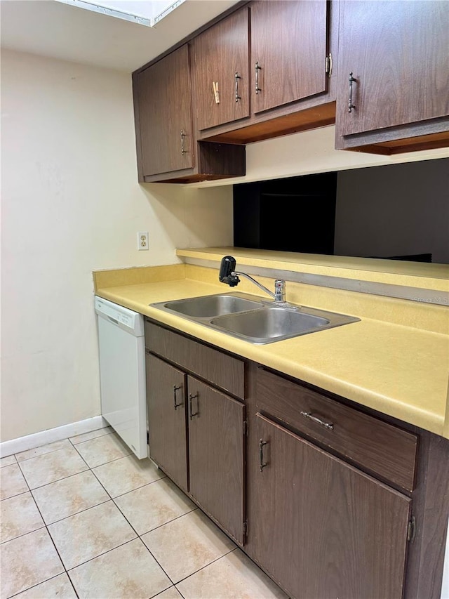 6324 Newtown Cir Unit 24B2, Tampa, FL 33615 - kitchen featuring dishwasher, a sink, baseboards, light tile patterned floors, and light countertops
