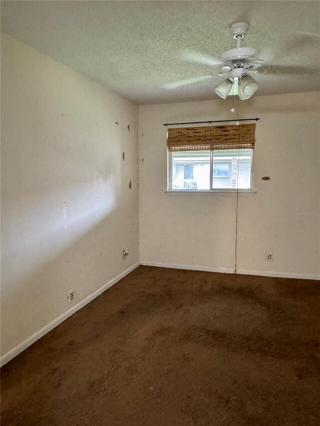 6324 Newtown Cir Unit 24B2, Tampa, FL 33615 - carpeted spare room featuring a textured ceiling, ceiling fan, and baseboards