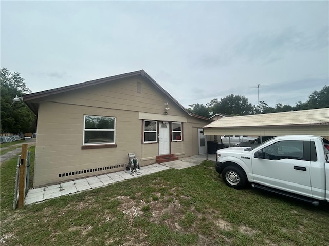 18133 US Highway 41, Spring Hill, FL 34610 - view of side of home with entry steps and a yard