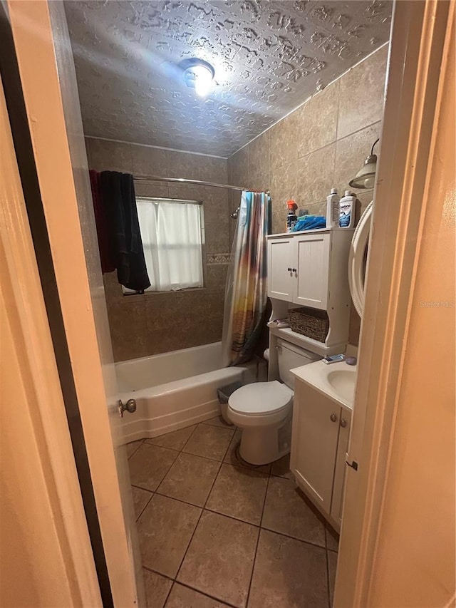 18133 US Highway 41, Spring Hill, FL 34610 - full bathroom with tile patterned flooring, shower / tub combo, toilet, vanity, and tile walls