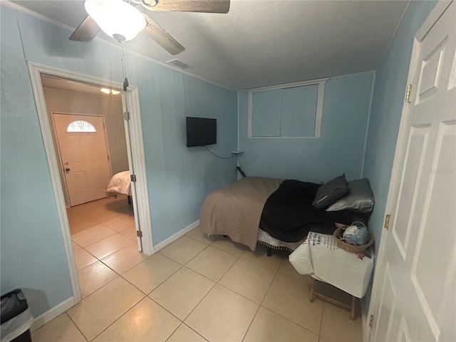 18133 US Highway 41, Spring Hill, FL 34610 - bedroom with light tile patterned floors, ceiling fan, and baseboards