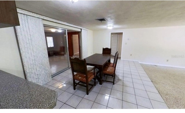 dining space with light tile patterned floors