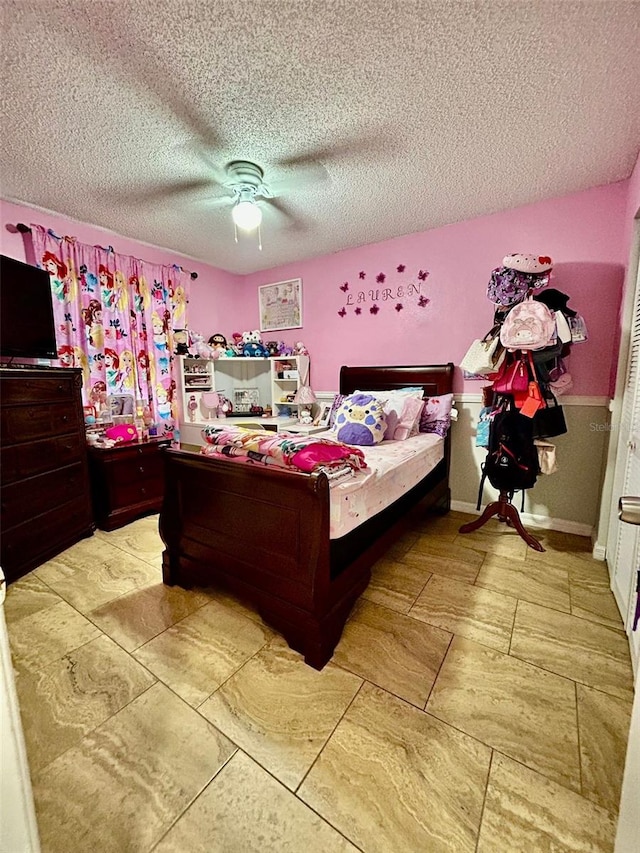 11521 Paperwood Pl, Riverview, FL 33579 - bedroom with a textured ceiling and a ceiling fan