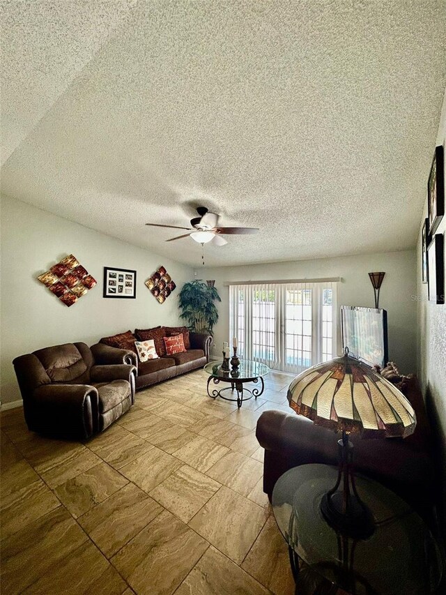 11521 Paperwood Pl, Riverview, FL 33579 - living room featuring ceiling fan and a textured ceiling