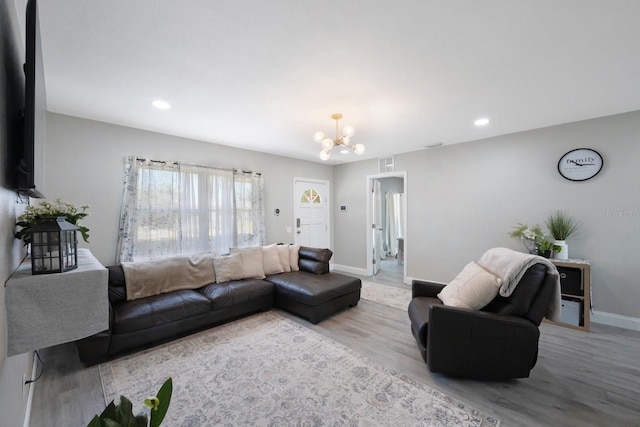8339 75th Ave, Seminole, FL 33777 - living area featuring a chandelier, wood finished floors, baseboards, and recessed lighting