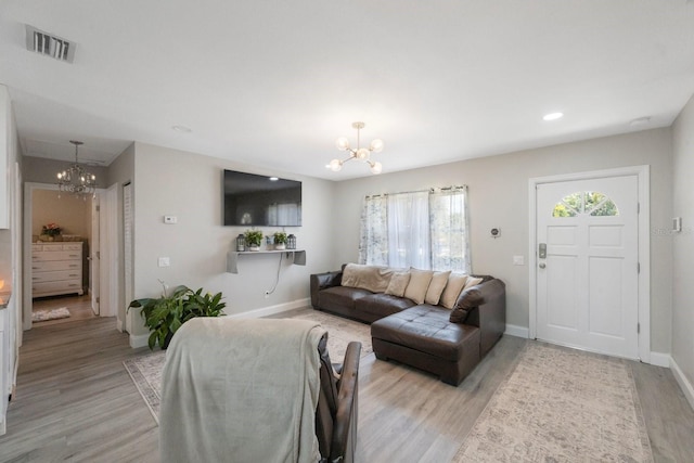 8339 75th Ave, Seminole, FL 33777 - living area with a chandelier, baseboards, light wood-type flooring, and recessed lighting