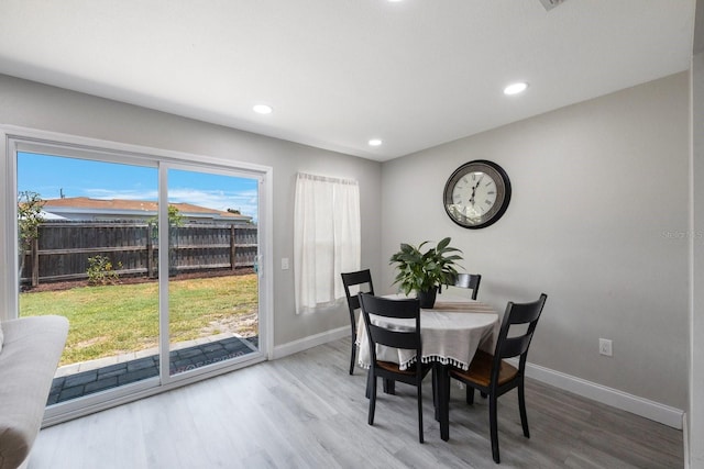 8339 75th Ave, Seminole, FL 33777 - dining area featuring wood finished floors, baseboards, and recessed lighting