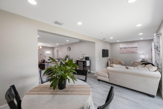 8339 75th Ave, Seminole, FL 33777 - living area featuring light wood-type flooring, recessed lighting, and baseboards
