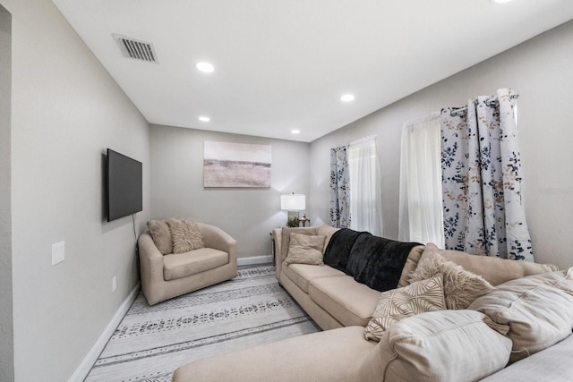8339 75th Ave, Seminole, FL 33777 - living room featuring baseboards and recessed lighting