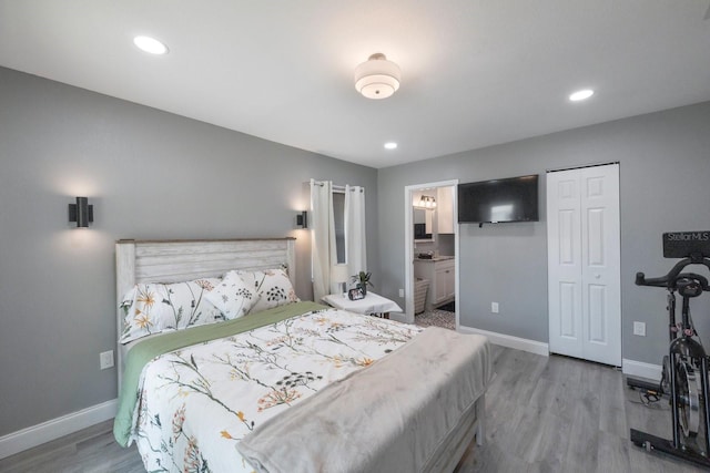 8339 75th Ave, Seminole, FL 33777 - bedroom featuring baseboards, wood finished floors, recessed lighting, and ensuite bath