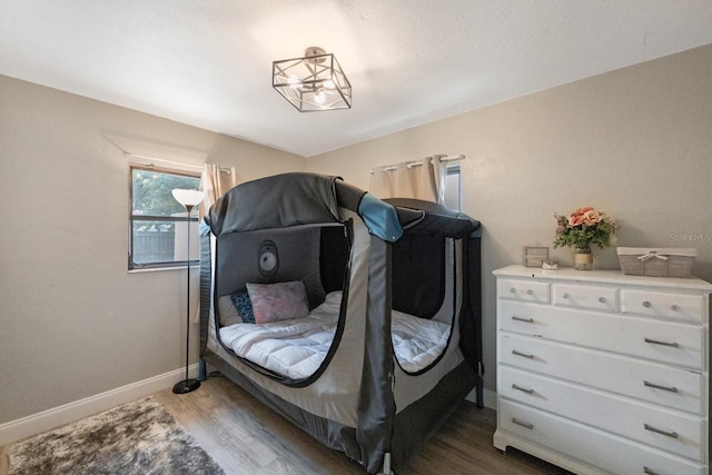 8339 75th Ave, Seminole, FL 33777 - bedroom with dark wood finished floors and baseboards