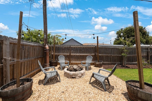 8339 75th Ave, Seminole, FL 33777 - fenced backyard featuring a fire pit