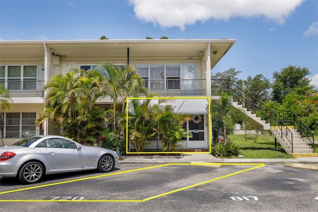 4154 56th St N Unit 720, Kenneth City, FL 33709 - view of front of house with stairway and uncovered parking