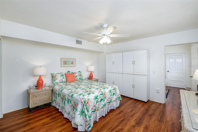 4154 56th St N Unit 720, Kenneth City, FL 33709 - bedroom featuring a closet, dark wood-style flooring, ceiling fan, and baseboards