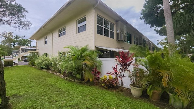 4154 56th St N Unit 720, Kenneth City, FL 33709 - view of property exterior with a yard