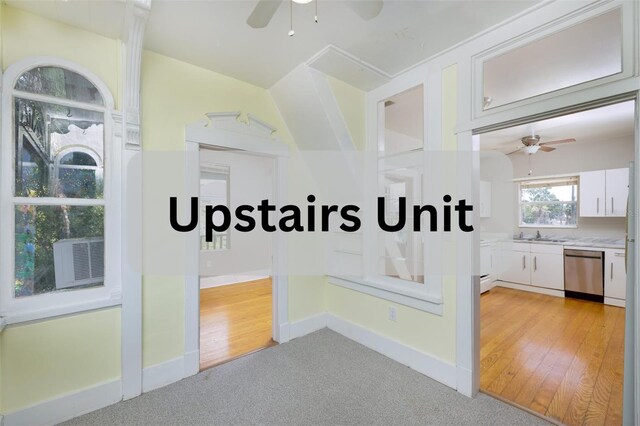 824 31st Ave N, Saint Petersburg, FL 33704 - hall featuring light carpet, baseboards, and cooling unit