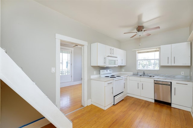 824 31st Ave N, Saint Petersburg, FL 33704 - kitchen with white appliances, a ceiling fan, light wood-type flooring, and light countertops