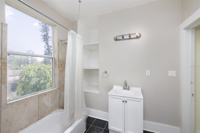 824 31st Ave N, Saint Petersburg, FL 33704 - bathroom with shower / bath combination with curtain, vanity, tile patterned flooring, and baseboards