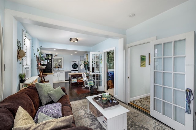 824 31st Ave N, Saint Petersburg, FL 33704 - living area featuring french doors, wood finished floors, and stacked washer / dryer