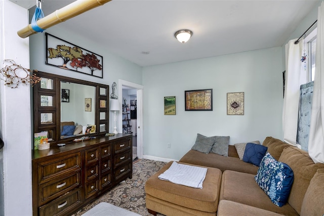 824 31st Ave N, Saint Petersburg, FL 33704 - living room with baseboards and dark carpet