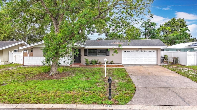 1737 Prince Philip St, Clearwater, FL 33755 - ranch-style home with a garage, driveway, stucco siding, and a shingled roof