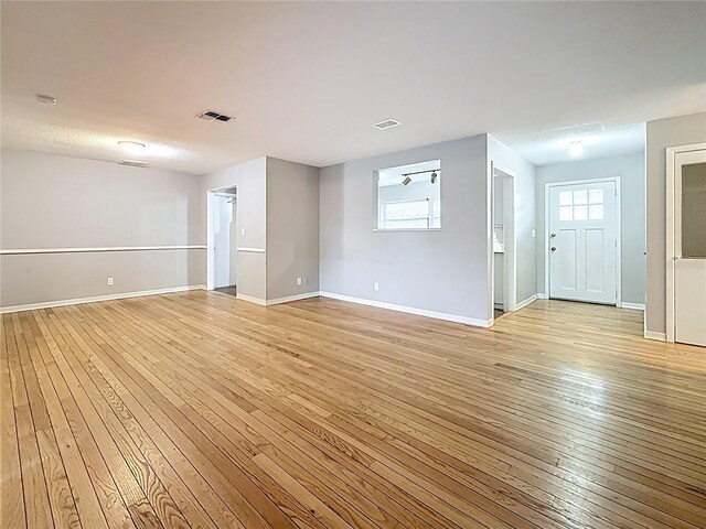 1737 Prince Philip St, Clearwater, FL 33755 - unfurnished room with light wood finished floors and baseboards