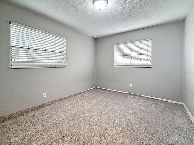 1737 Prince Philip St, Clearwater, FL 33755 - empty room with carpet and a textured ceiling