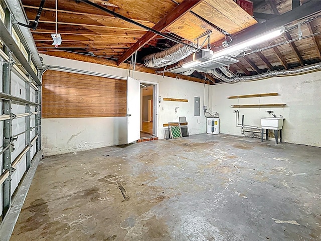 1737 Prince Philip St, Clearwater, FL 33755 - garage featuring electric panel, electric water heater, a garage door opener, and a sink