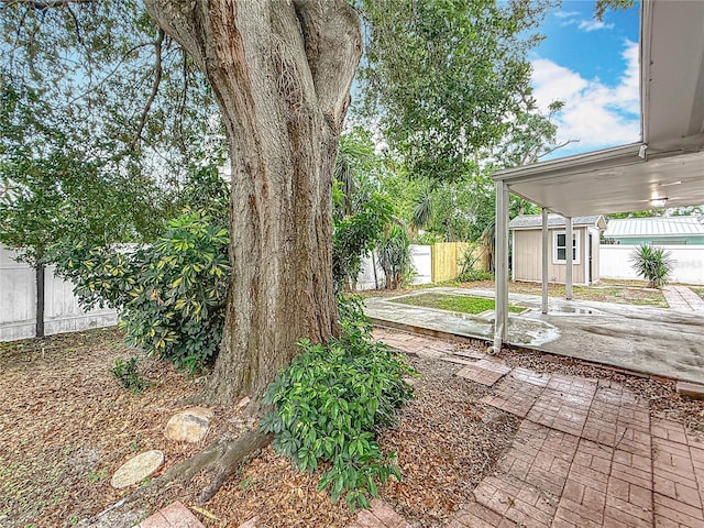 1737 Prince Philip St, Clearwater, FL 33755 - fenced backyard with a patio area