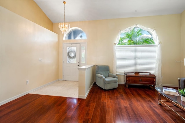 28390 Openfield Loop, Wesley Chapel, FL 33543 - foyer entrance featuring wood finished floors, a chandelier, healthy amount of natural light, baseboards, and lofted ceiling