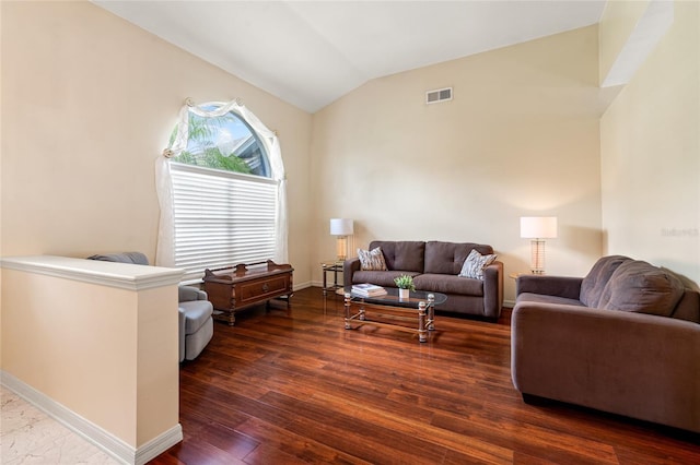28390 Openfield Loop, Wesley Chapel, FL 33543 - living room with vaulted ceiling, dark wood-type flooring, and baseboards