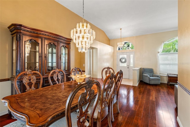 28390 Openfield Loop, Wesley Chapel, FL 33543 - dining area with dark wood-style floors, a chandelier, lofted ceiling, and baseboards