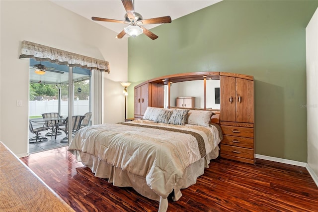 28390 Openfield Loop, Wesley Chapel, FL 33543 - bedroom with access to exterior, dark wood-type flooring, baseboards, a ceiling fan, and arched walkways
