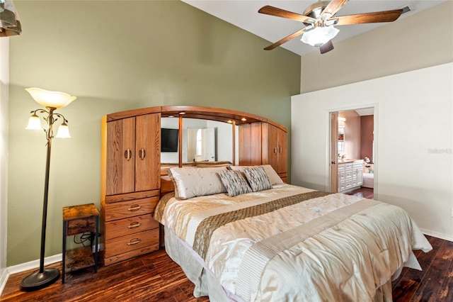 28390 Openfield Loop, Wesley Chapel, FL 33543 - bedroom with high vaulted ceiling, dark wood-type flooring, baseboards, a ceiling fan, and ensuite bathroom