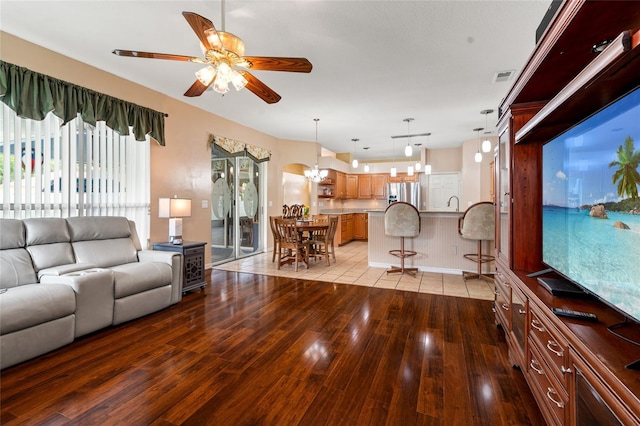 28390 Openfield Loop, Wesley Chapel, FL 33543 - living area featuring light wood-type flooring, ceiling fan, baseboards, and a chandelier