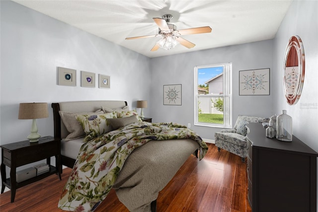 28390 Openfield Loop, Wesley Chapel, FL 33543 - bedroom featuring dark wood-type flooring, a ceiling fan, and baseboards