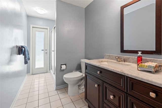 28390 Openfield Loop, Wesley Chapel, FL 33543 - full bath featuring tile patterned floors, vanity, baseboards, a shower stall, and toilet