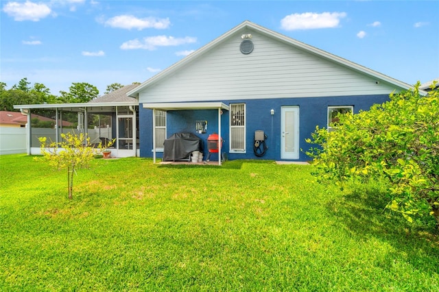 28390 Openfield Loop, Wesley Chapel, FL 33543 - rear view of property with a sunroom and stucco siding