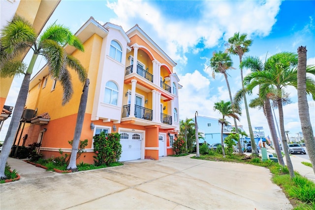 17817 Gulf Blvd Unit A, Saint Petersburg, FL 33708 - view of building exterior with an attached garage and driveway