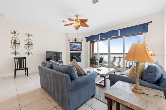 17817 Gulf Blvd Unit A, Saint Petersburg, FL 33708 - living room featuring light tile patterned floors, a ceiling fan, and baseboards