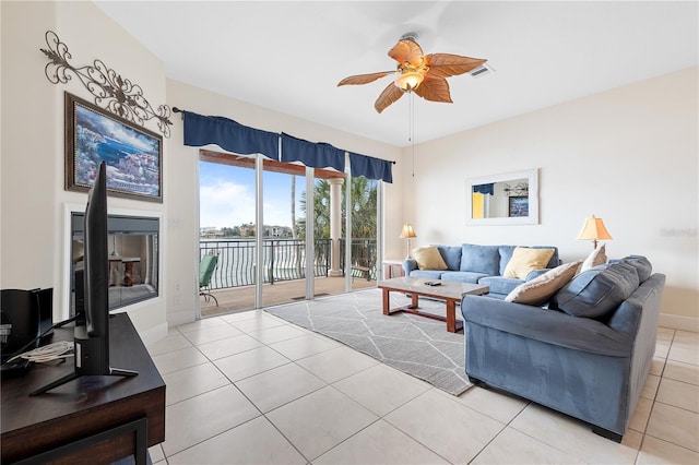 17817 Gulf Blvd Unit A, Saint Petersburg, FL 33708 - living room with a ceiling fan, light tile patterned floors, baseboards, and a water view
