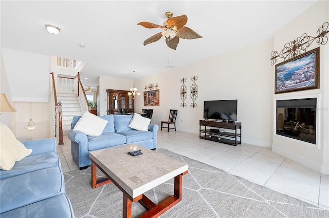 17817 Gulf Blvd Unit A, Saint Petersburg, FL 33708 - living room with light tile patterned flooring, stairs, a ceiling fan, and baseboards