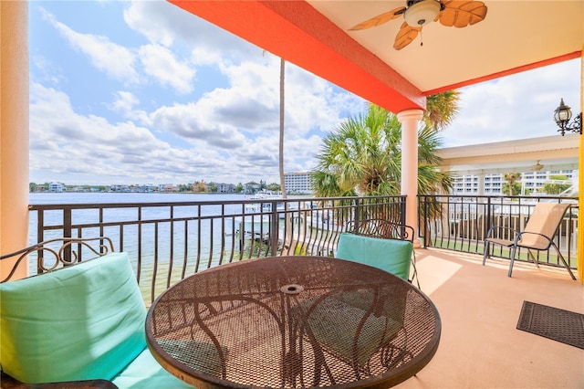 17817 Gulf Blvd Unit A, Saint Petersburg, FL 33708 - balcony with a ceiling fan, a water view, and outdoor dining space