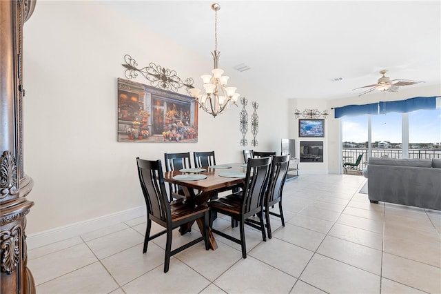17817 Gulf Blvd Unit A, Saint Petersburg, FL 33708 - dining room with a chandelier, light tile patterned floors, ceiling fan, and baseboards