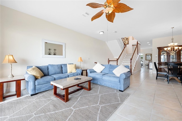 17817 Gulf Blvd Unit A, Saint Petersburg, FL 33708 - living area with stairs, light tile patterned floors, ceiling fan, and a chandelier