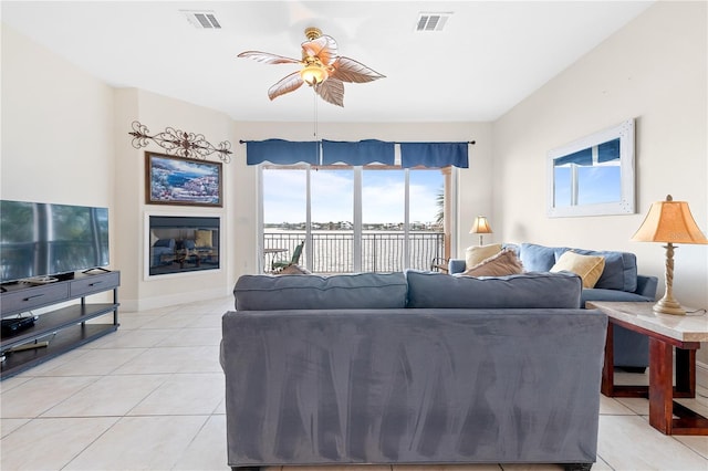 17817 Gulf Blvd Unit A, Saint Petersburg, FL 33708 - living room with light tile patterned flooring, a ceiling fan, and baseboards