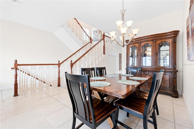17817 Gulf Blvd Unit A, Saint Petersburg, FL 33708 - dining space with a chandelier, baseboards, light tile patterned flooring, and stairs