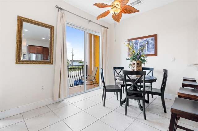 17817 Gulf Blvd Unit A, Saint Petersburg, FL 33708 - dining space with a ceiling fan, baseboards, and light tile patterned floors