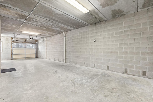 17817 Gulf Blvd Unit A, Saint Petersburg, FL 33708 - garage with concrete block wall and a garage door opener